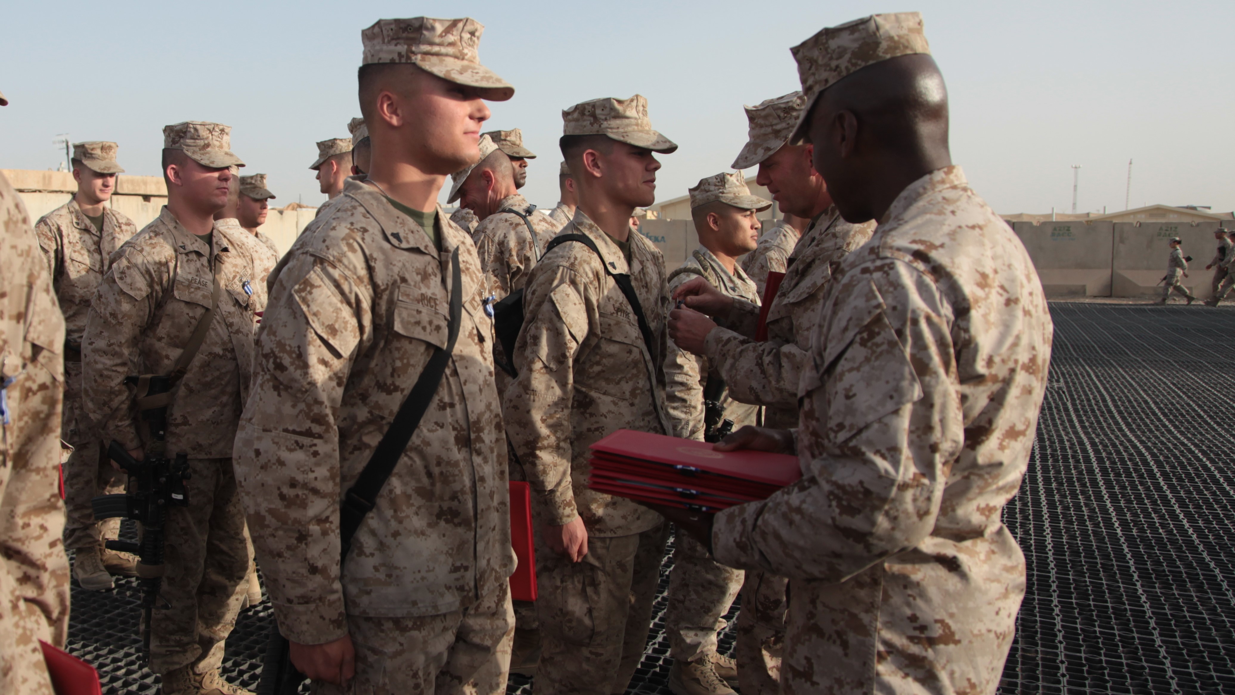 Service member receives NATO medal from Gen. Berger, Afghanistan (2012). Courtesy of the U.S. Department of Defense.